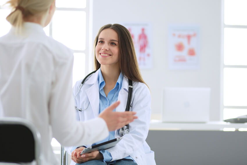 Female doctor speaking to patient